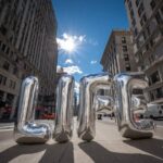 Prompt:Huge [COLOR] balloons in the form of...