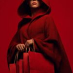 Prompt:A woman in a bright cherry a...