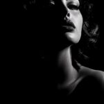 photograph of a femme fatale, solid black background --ar 3:5 --v 6.1by dmk_stor...