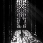 In the shadows of an ancient mosque, I stood alone in darkness and quietude, gaz...