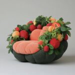 PromptA sofa made of [fruit] against a...