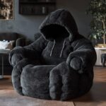 a cozy black fur lounge chair in the shape of a hoodie with hoodie strings in a ...