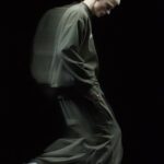 Ultra-realistic, studio photograph of a blonde male model, close face shot again...