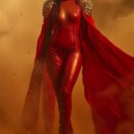 A high-fashion editorial shot of a Black Brazilian woman standing tall in the mi...