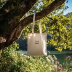 Prompt:A tote bag with the words [YOUR...