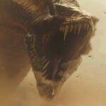 a tiny fremen warrior from dune in a vast sand desert with a giant ferocious san...