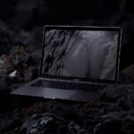 Realistic and mystic photography of Macbook Pro 2024 with blank sceen placed on ...