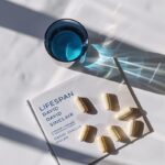 Product photography of four white supplements, five light-brown supplements and ...