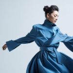 the white background, master deaign fashionable blue wind coat,The individual in...