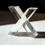 clear glass X shape; beautiful shadows; plain background --v 6.1by ahark123 Prom...