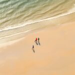 Four stranded people in the beach on a tropical tropical beach, in the style of ...