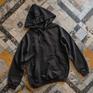 black oversized hoodie lies on the tiles in Milan, realistic --v 6by rolhik#prod...
