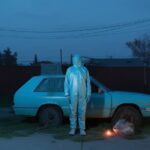 prompt a man wearing uniform is standing...