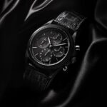 Capture the essence of time in the sleek elegance of a black watch against the c...