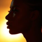 A full - body silhouette of a female figure, intricately designed in the style o...