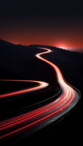 The moon shines across a motorway where the cars speed along, in the style of da...