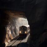 10 cool short prompts for Midjourney V5 6. Photorealistic industrial train exiti...