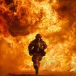 A brave and handsome chinese firefighter, risking his life, urgently sprints tow...