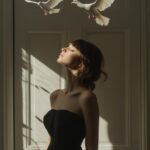 a realistic Long shot photograph of a woman standing in front of a white door wi...