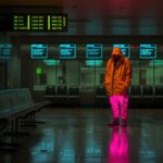 an image of poignant emotional,a fluorescent man waiting in an airport for a del...