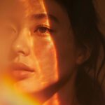 ethereal, contemporary portrait photograph, a woman’s contemplative face partial...