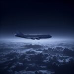 a Boeing 747 appearing just above the clouds on a dark night in a moody scene --...