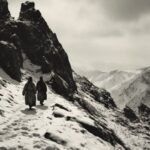 Tibetan monks are walking in the snow-covered mountains, vintage photo of the 40...