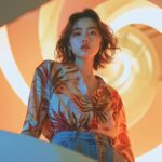 Low camera angle shot, half-length portrait, warm and cold tones，super impact An...