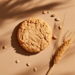 Macro photograph of Oatmeal cookie, with wheat grains and ear of wheat, captured...