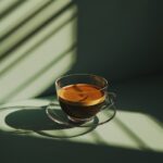 generate a photorealistic image of a cup of coffee in a transparent cup on a aes...