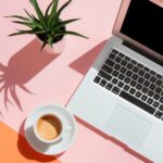 sleek flatlay with a laptop, a small plant and a coffee cup. Minimalist and phot...
