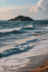 On the Mediterranean seaside, people are walking on the beach. There is a small ...