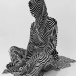 a black & white photo of a woman sitting in a striped position, in the style...