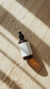 A hair care product like shampoo or conditioner bottle positioned on its side on...
