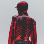 person with tranparent red skin showing their skeleton underneath --ar 4:5 --s 2...