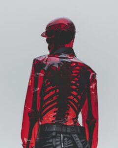person with tranparent red skin showing their skeleton underneath --ar 4:5 --s 2...