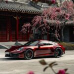 The brand new Porsche 911 in burgundy red. Black 24 inch wheels, red brake calip...