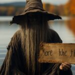 Wild crazy intense witch holding a sign, emerging from a peacful lake in Maine, ...