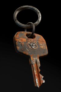 RUSTY Toyota car keys with Ein key chain, floating in black background , full de...