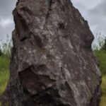 Jagged stone boulder, overcast lighting, side view --v 5 --ar 1:2by darkmarmot P...