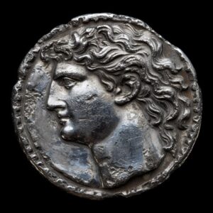 Для нумизматовancient texture face of archaic greek silver coin with head of jan...