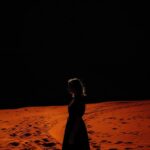 creative silhouette of a woman, In the background behind it there is only orange...