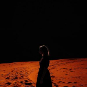 creative silhouette of a woman, In the background behind it there is only orange...