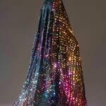 a realistic abstract character created with a flowing robe that looks like a mos...