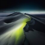 Night, minimalistic icy white dune desert landscape with a acid green river, gra...