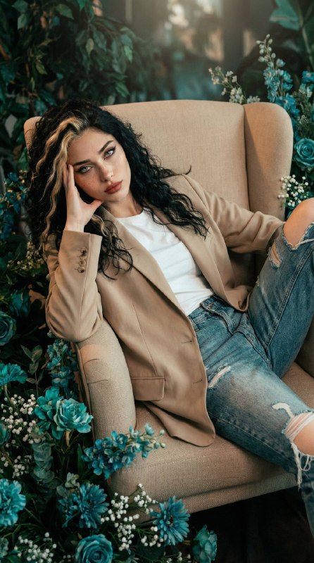 “vertical editorial portrait of model reclining on...