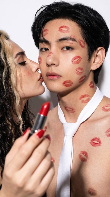 Portrait of a young shirtless man wearing...