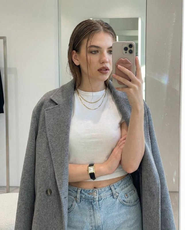 Candid mirror selfie in a high end...