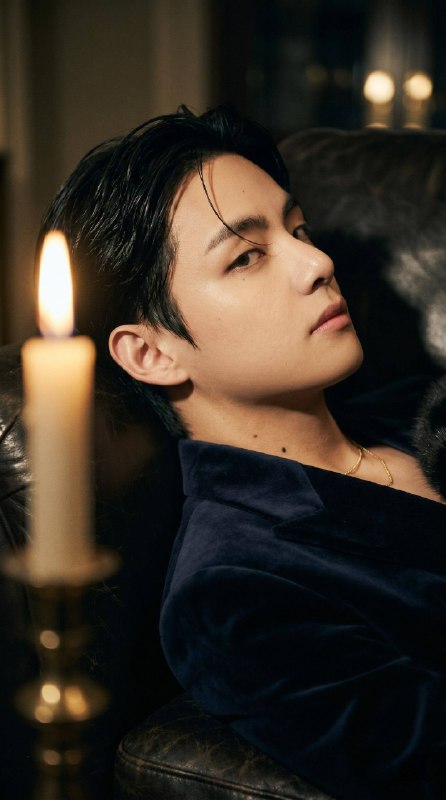 Vertical cinematic intimate portrait in candlelight. Warm...